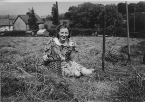 Haymaking scene featuring Cissie Gunn- enjoying a mug of cider from ...